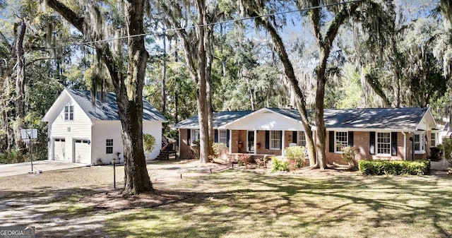 ranch-style house with a front yard, driveway, a porch, a garage, and brick siding