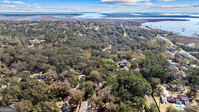 bird's eye view with a forest view and a water view