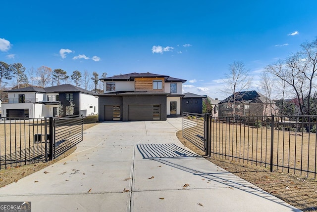 view of front of house featuring fence, a garage, driveway, and stucco siding