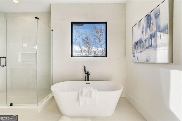 bathroom featuring a shower stall, recessed lighting, and a freestanding bath