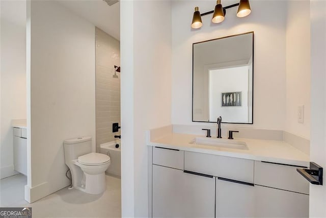 full bathroom featuring tile patterned flooring, toilet, and vanity