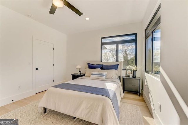 bedroom featuring recessed lighting, baseboards, light wood-style floors, and a ceiling fan