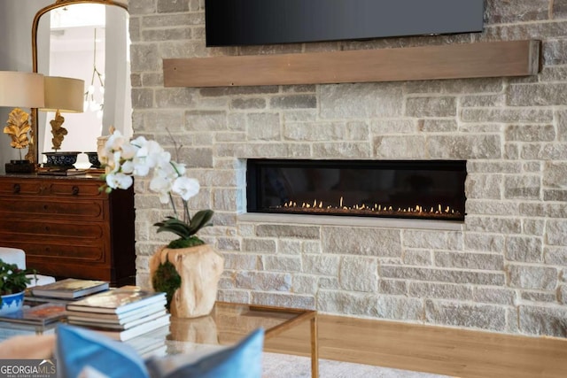 room details with wood finished floors and a fireplace