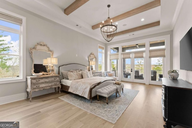 bedroom with an inviting chandelier, access to exterior, french doors, beamed ceiling, and light wood-type flooring
