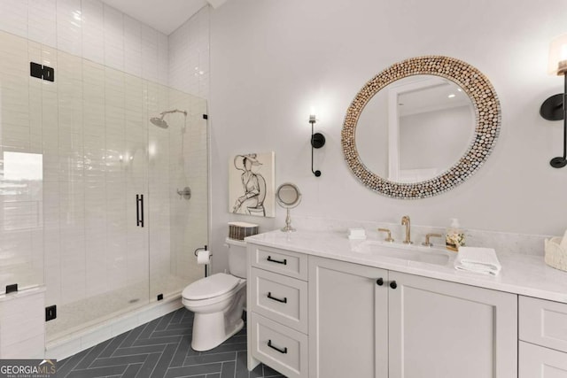 full bathroom with tile patterned floors, a stall shower, toilet, and vanity