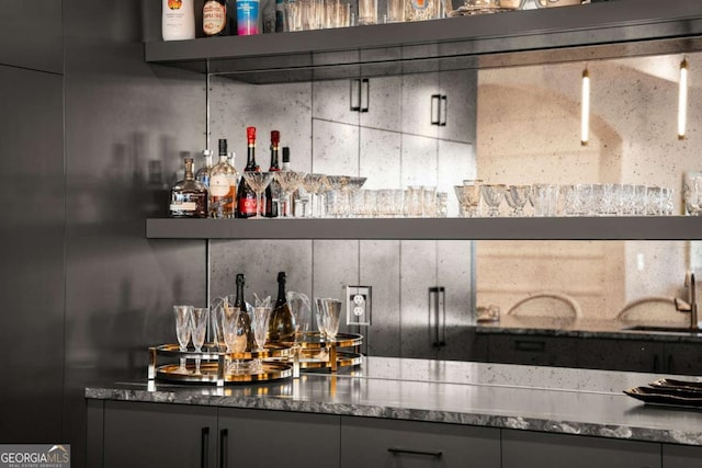 bar featuring a dry bar and a sink