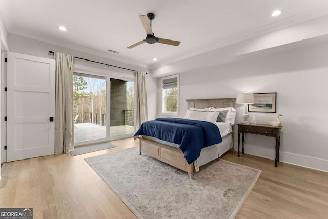 bedroom featuring access to exterior, visible vents, light wood-type flooring, and baseboards