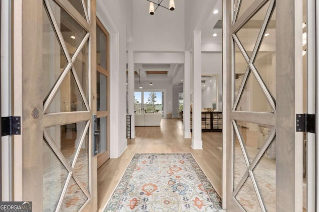 foyer featuring a high ceiling and wood finished floors