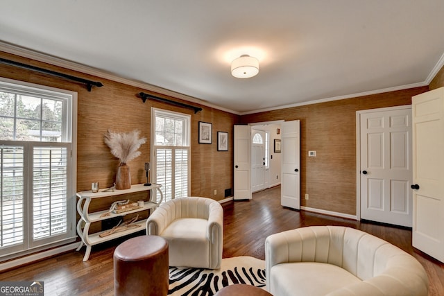 living area featuring crown molding and dark wood-style floors