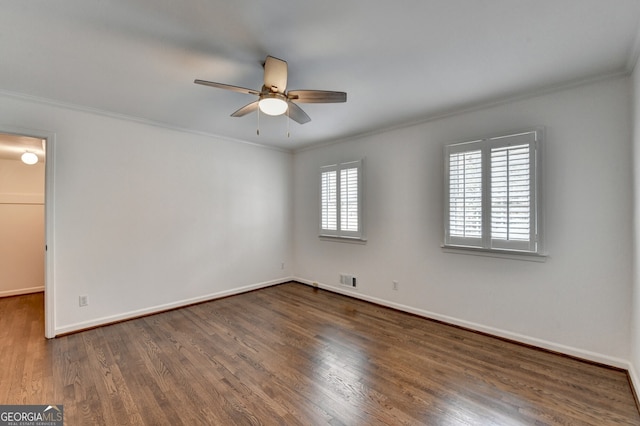 unfurnished room with crown molding, wood finished floors, a ceiling fan, and baseboards