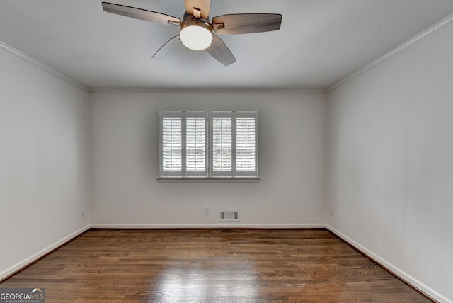 spare room featuring visible vents, crown molding, ceiling fan, and wood finished floors