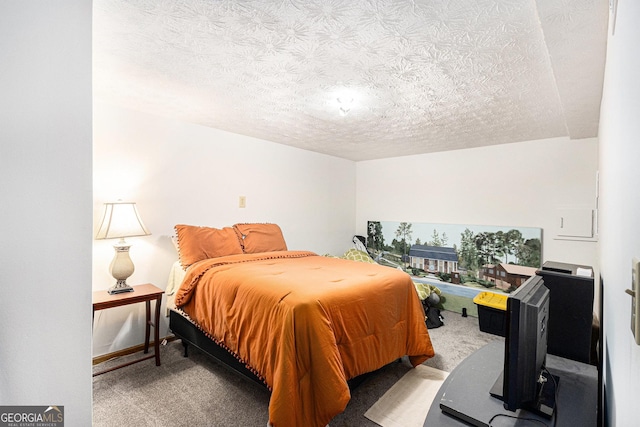 carpeted bedroom with a textured ceiling