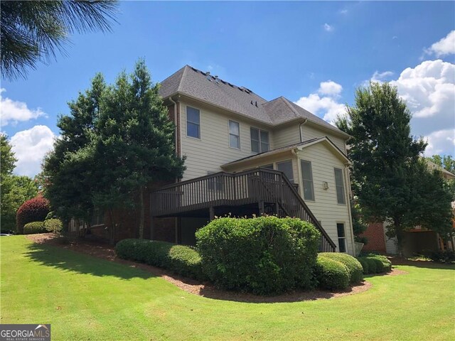 2741 Willowstone Dr, Duluth, GA 30096 - back of property with a wooden deck, stairway, and a yard