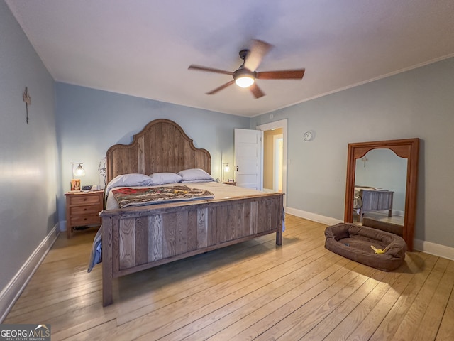 bedroom with light wood finished floors, ceiling fan, and baseboards