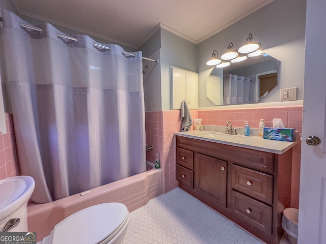 bathroom with ornamental molding, tile patterned flooring, shower / tub combo, tile walls, and toilet