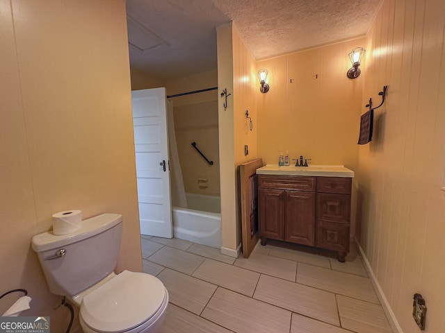 full bath with vanity,  shower combination, toilet, and a textured ceiling