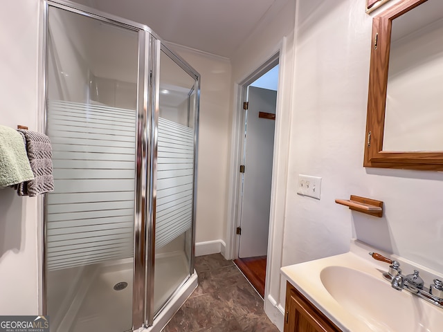 bathroom featuring vanity and a shower stall