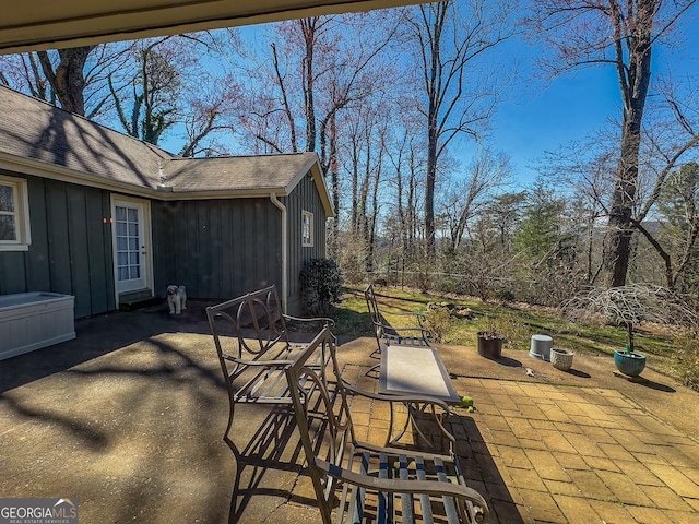 view of patio featuring fence