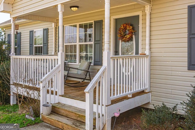 view of exterior entry featuring a porch