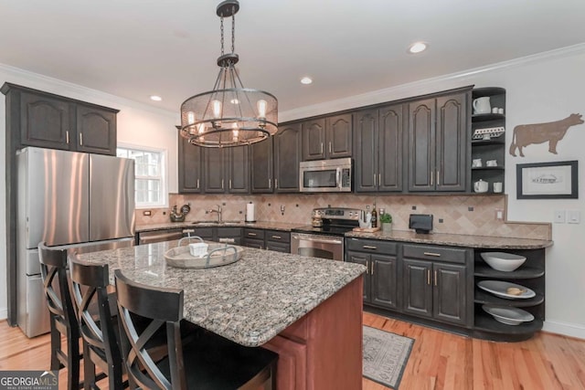 kitchen featuring open shelves, light stone countertops, a chandelier, and stainless steel appliances