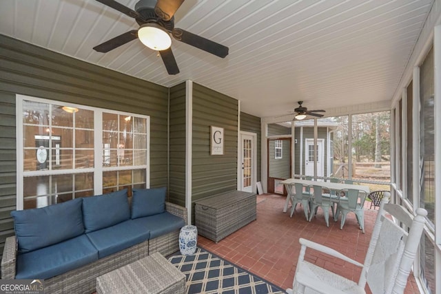 view of patio with outdoor dining space, ceiling fan, and an outdoor hangout area