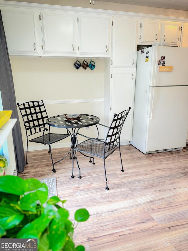 dining room featuring light wood-style floors