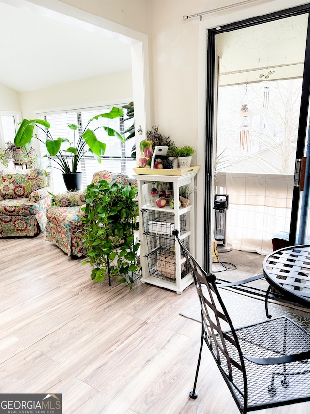 interior space with wood finished floors and a wealth of natural light