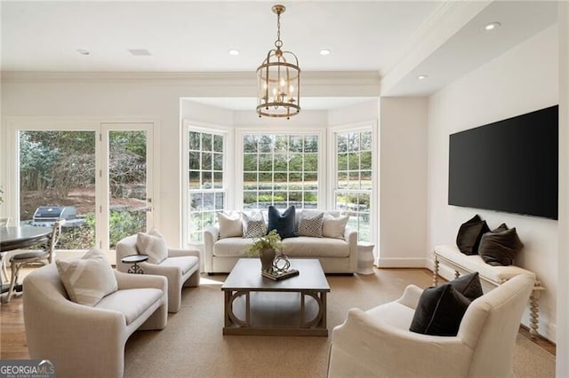 living area with recessed lighting, baseboards, wood finished floors, and ornamental molding