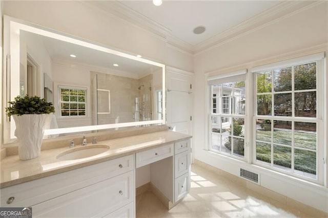 bathroom with visible vents, a healthy amount of sunlight, crown molding, a stall shower, and vanity