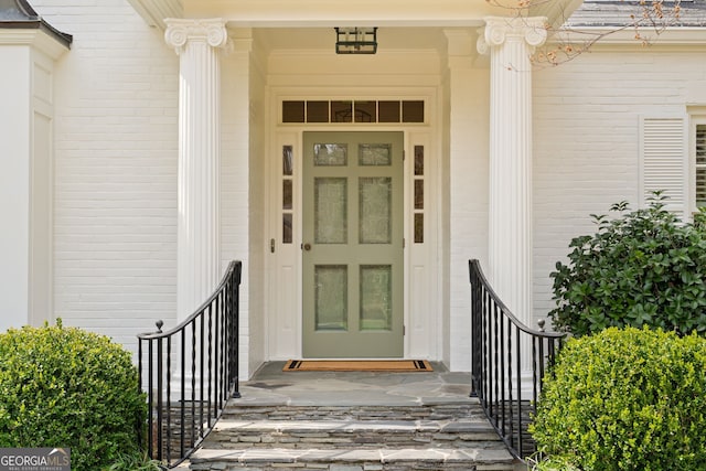 entrance to property with brick siding