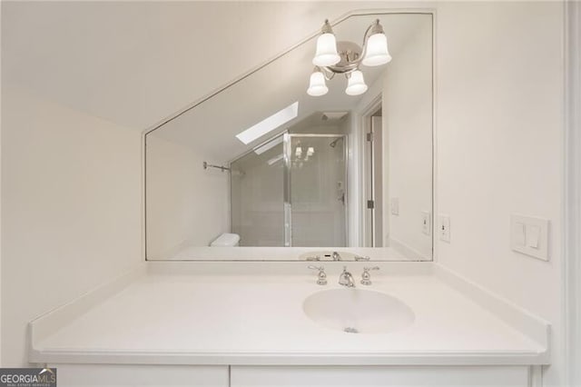 bathroom with vanity and a shower stall