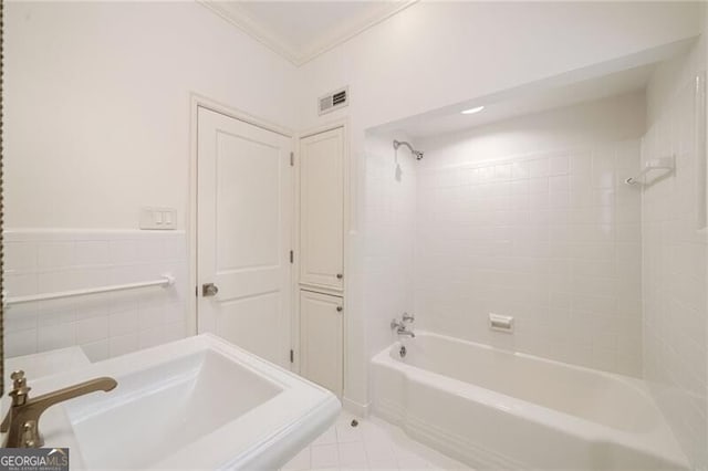 full bath featuring visible vents, shower / tub combination, crown molding, and tile patterned flooring