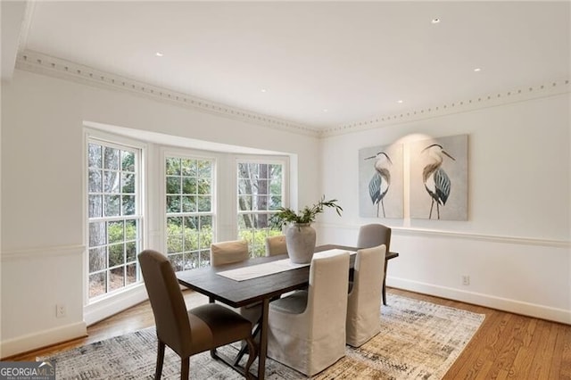 dining room featuring baseboards and wood finished floors