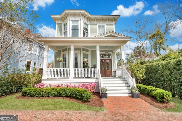 italianate house with french doors and covered porch