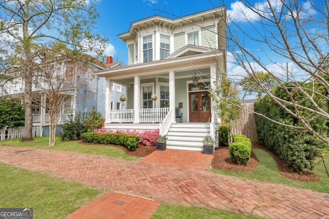 italianate home with french doors and a porch