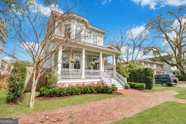 italianate house with covered porch and a front lawn