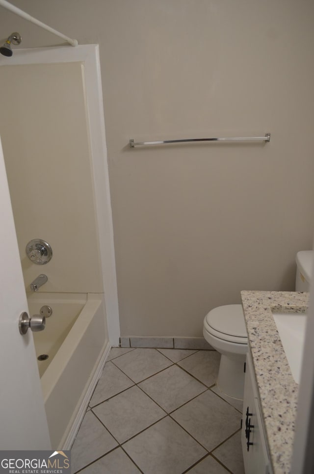 bathroom with tile patterned floors, toilet, and vanity