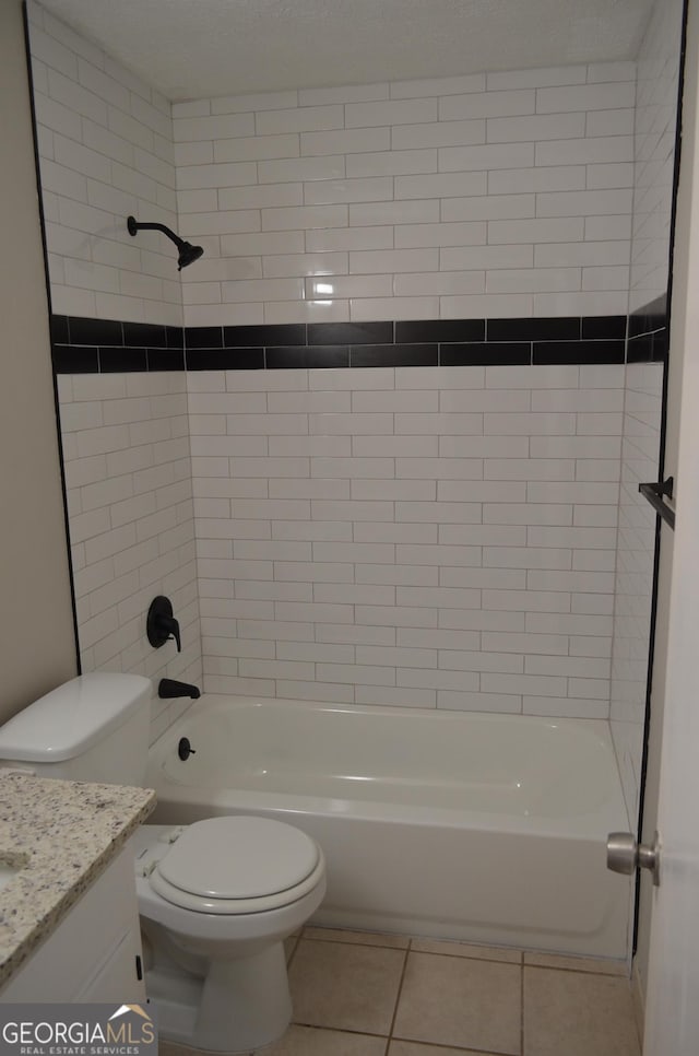 full bathroom featuring toilet,  shower combination, vanity, and tile patterned flooring