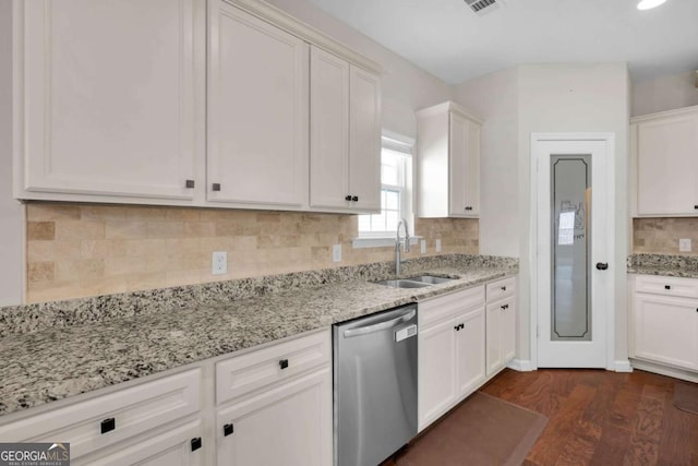 kitchen featuring a sink, white cabinets, dark wood-type flooring, and stainless steel dishwasher