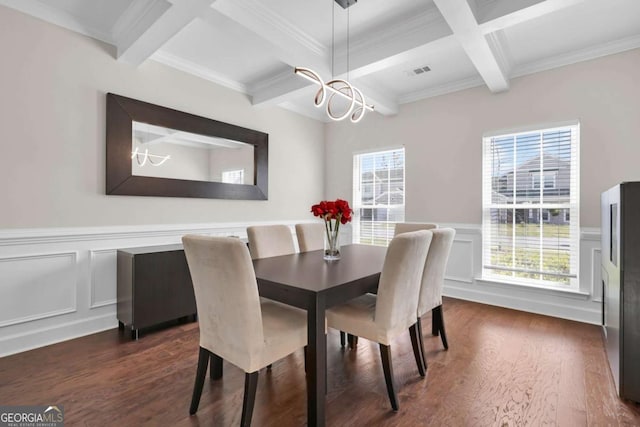 dining space featuring a chandelier, beam ceiling, and dark wood-style flooring