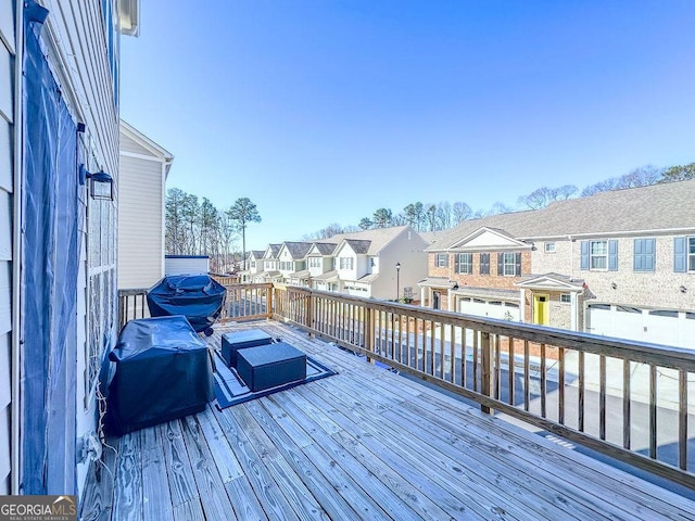 deck featuring a residential view and area for grilling