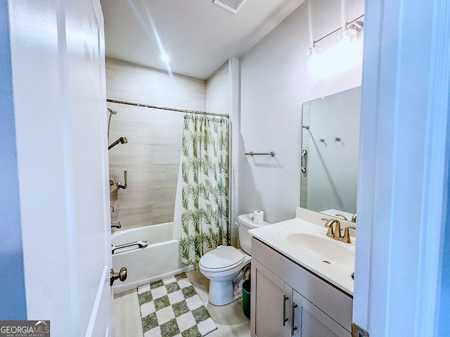 full bath with visible vents, toilet, vanity, and shower / tub combo with curtain