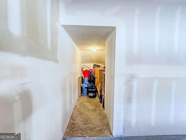 hallway with concrete flooring