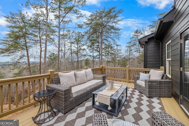 wooden terrace featuring an outdoor living space