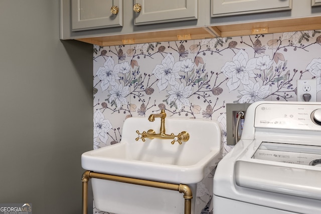 laundry area with washer / dryer and cabinet space