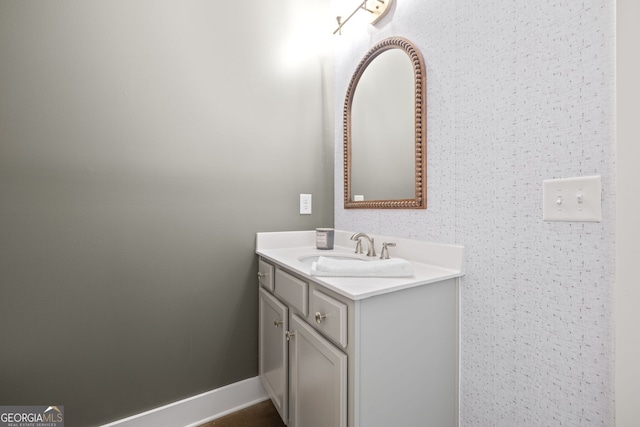 bathroom featuring baseboards and vanity