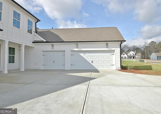 garage with concrete driveway