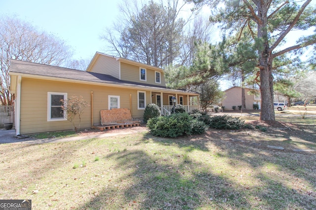 view of front of house with a front lawn and covered porch