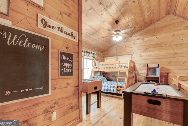 bedroom with lofted ceiling, wooden ceiling, wood walls, and wood-type flooring