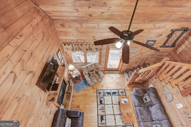 unfurnished living room featuring ceiling fan